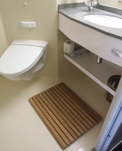 Spa accommodations include a wooden mat in the stateroom bathroom.